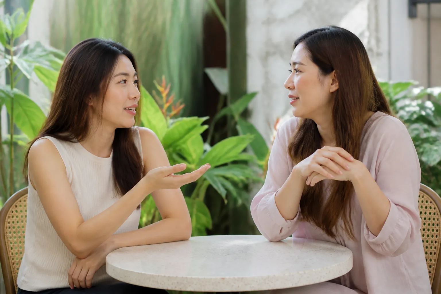 A Malaysian woman preparing questions before making contact
